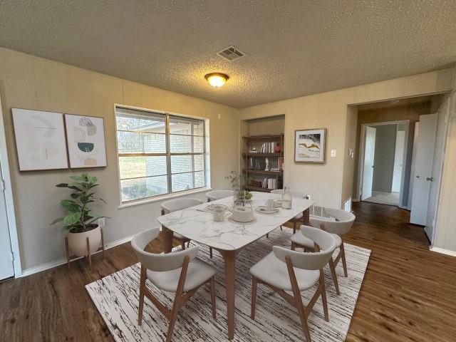 1045 HCR 2124 Loop Whitney, TX 76692 - Photo 9 of 26 a view of a dining room with furniture and wooden floor