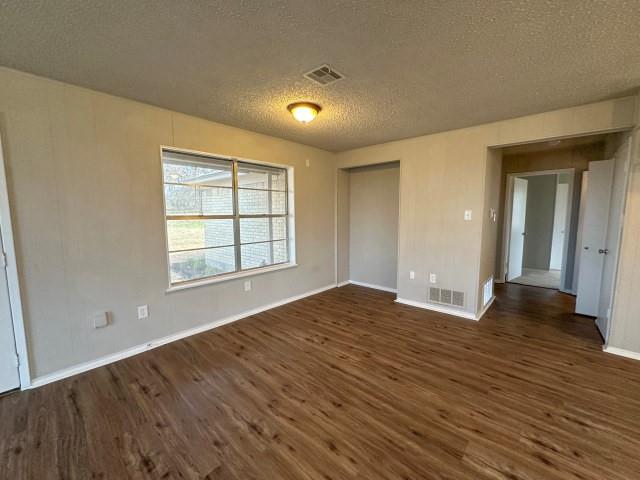 1045 HCR 2124 Loop Whitney, TX 76692 - Photo 10 of 26 wooden floor in an empty room with a window
