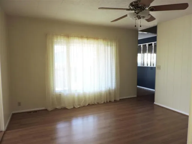 a kitchen with stainless steel appliances a sink and a refrigerator