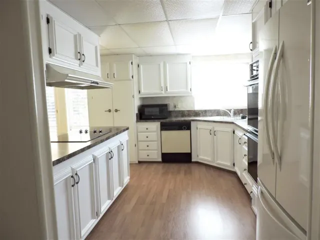 a view of empty room with a fireplace