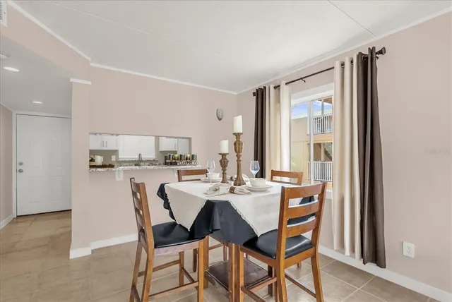a view of a dining room with furniture and window