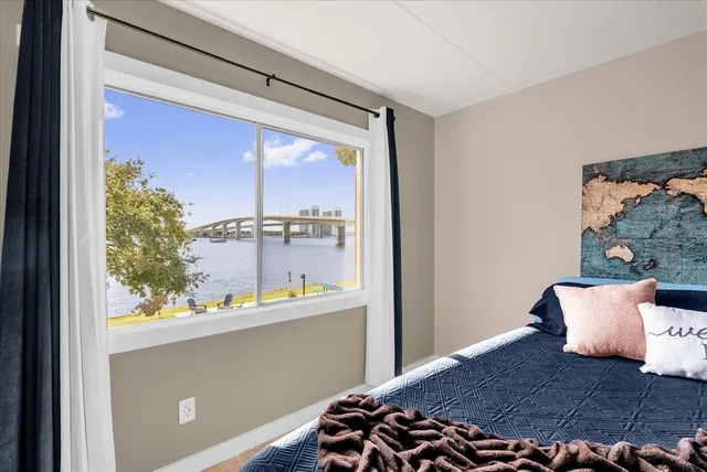 a room with a bed and a window