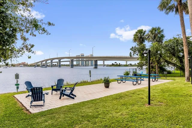 a view of a swimming pool with a patio and a garden