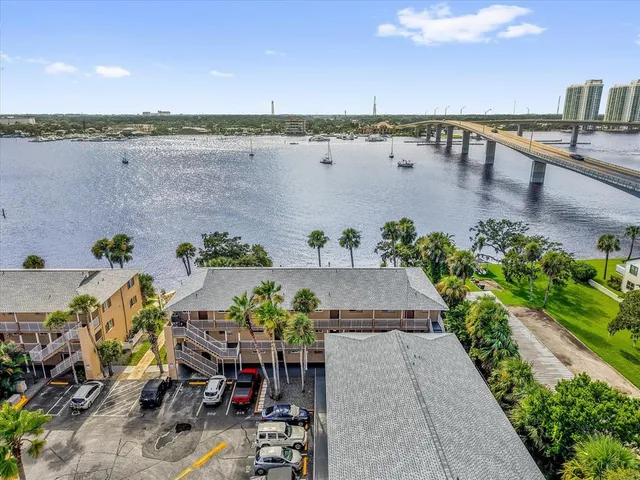 a view of a terrace with dining table and chairs