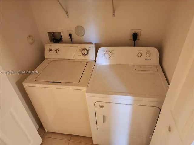 a utility room with dryer and washer