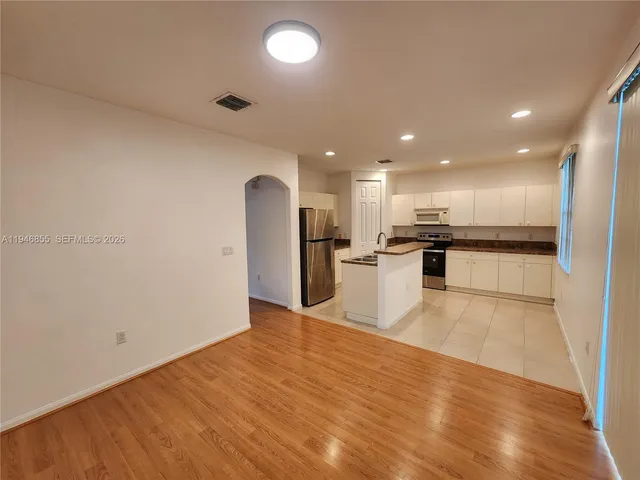 a view of kitchen with wooden floor