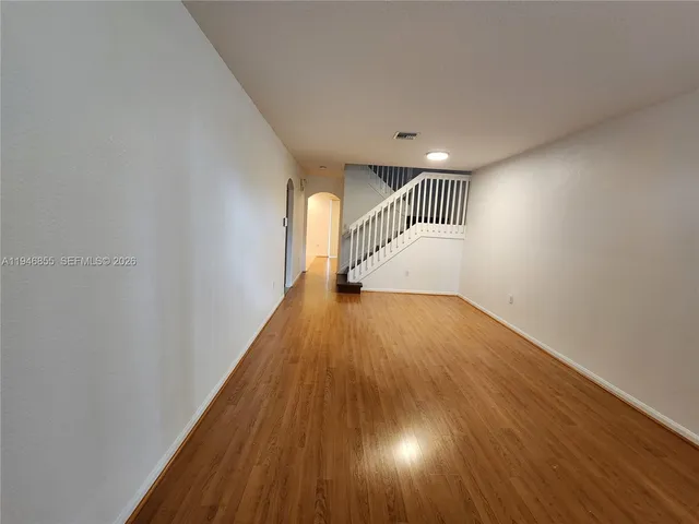 a view of entryway with wooden floor