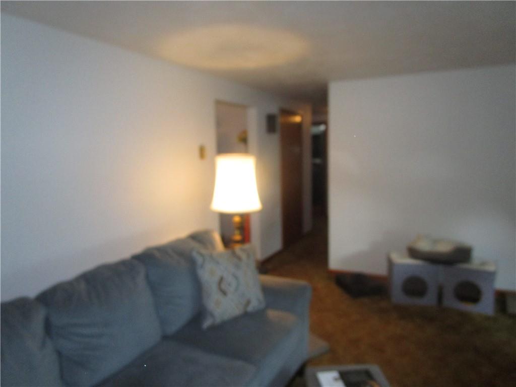 112 State Hill Road Smithton, PA 15479 - Photo 12 of 25 a living room with furniture and a lamp