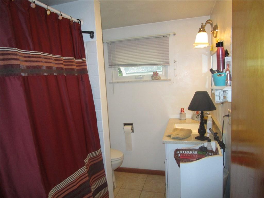 112 State Hill Road Smithton, PA 15479 - Photo 15 of 25 a bathroom with a toilet and a mirror