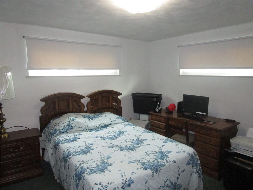 112 State Hill Road Smithton, PA 15479 - Photo 17 of 25 a bedroom with bed and a desk