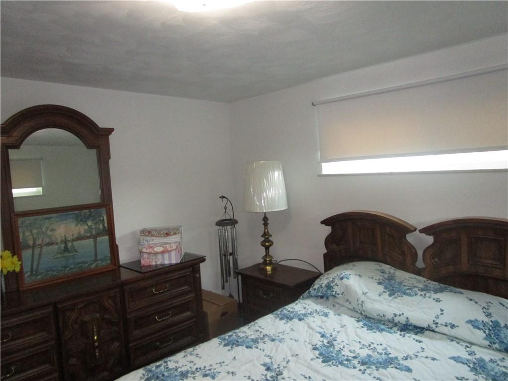 112 State Hill Road Smithton, PA 15479 - Photo 18 of 25 a bedroom with a bed and a dresser
