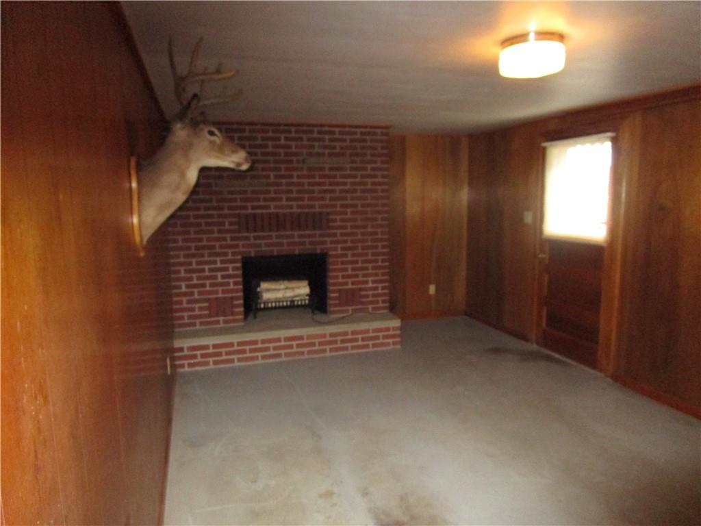 112 State Hill Road Smithton, PA 15479 - Photo 20 of 25 a view of an empty room with a fireplace