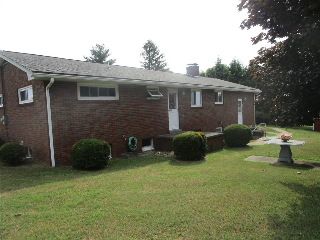 112 State Hill Road Smithton, PA 15479 - Photo 23 of 25 a view of a house with backyard and sitting area
