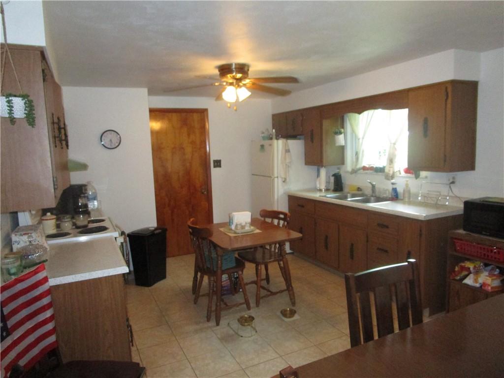 112 State Hill Road Smithton, PA 15479 - Photo 7 of 25 a view of a dining room with furniture and window