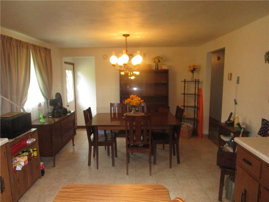 112 State Hill Road Smithton, PA 15479 - Photo 9 of 25 a view of a dining room with furniture and wooden floor