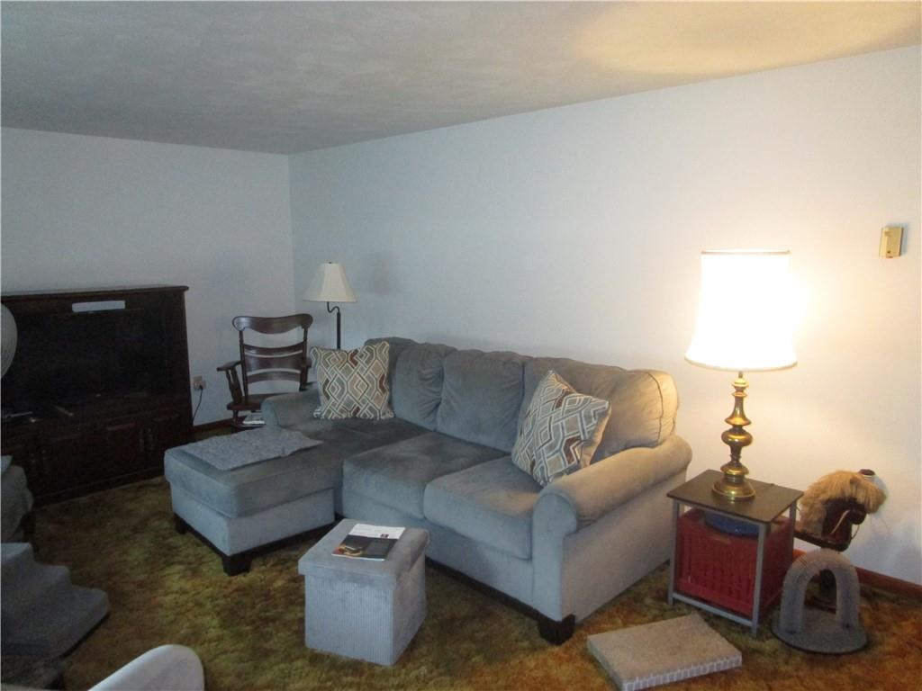 112 State Hill Road Smithton, PA 15479 - Photo 10 of 25 a living room with furniture and a lamp
