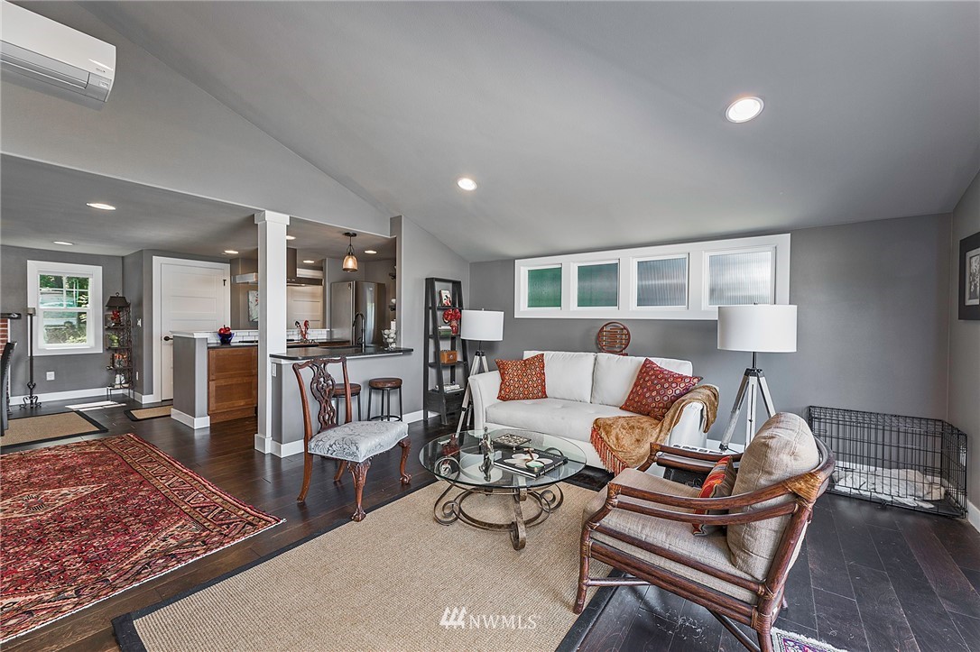14301 Outer Bay Road Anderson Island, WA 98303 - Photo 11 of 40 a living room with furniture and a rug