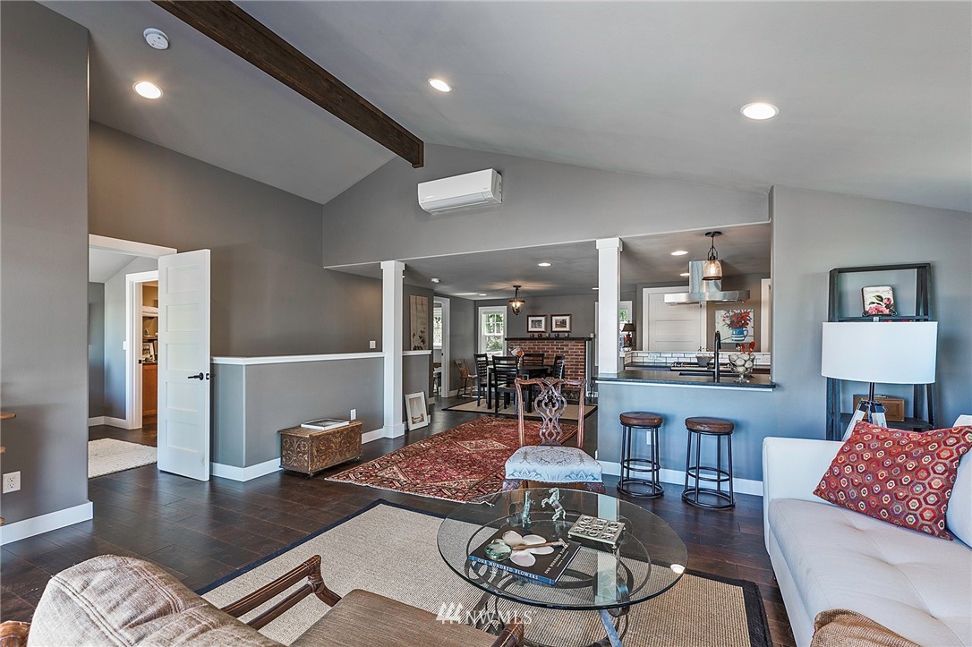 14301 Outer Bay Road Anderson Island, WA 98303 - Photo 12 of 40 a living room with furniture and a wooden floor