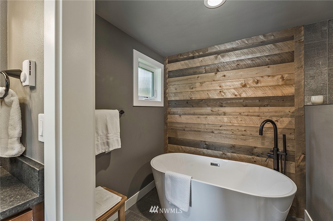 14301 Outer Bay Road Anderson Island, WA 98303 - Photo 17 of 40 a bathroom with a sink a toilet and shower