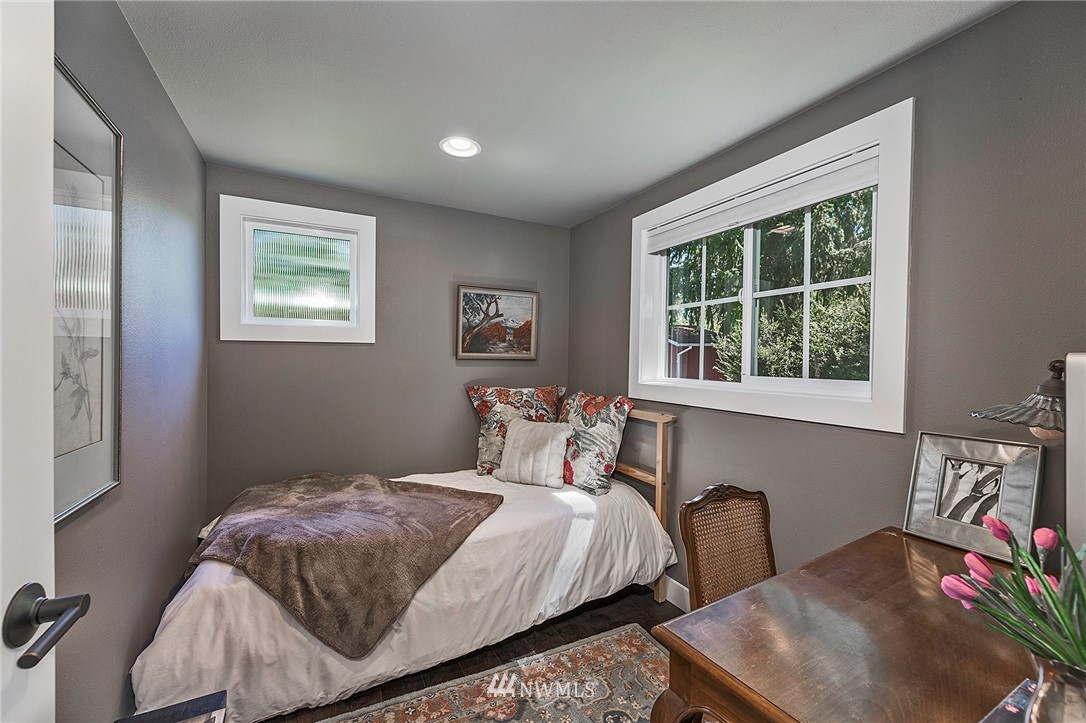 14301 Outer Bay Road Anderson Island, WA 98303 - Photo 18 of 40 a bedroom with a bed a closet and a window