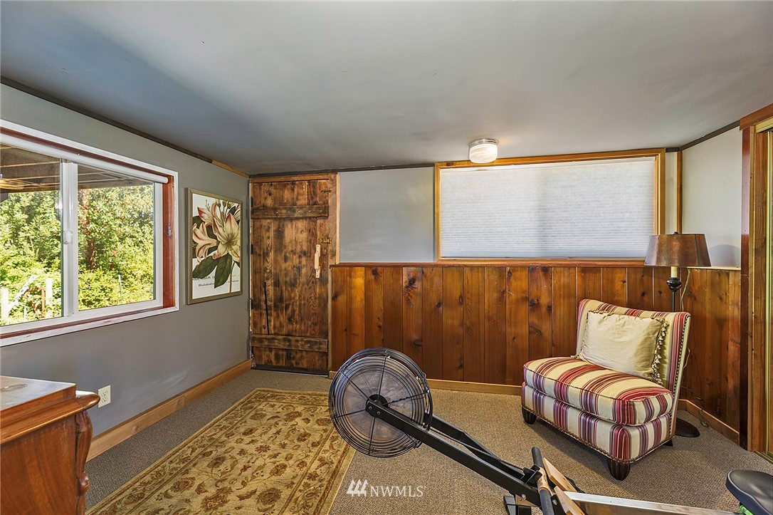 14301 Outer Bay Road Anderson Island, WA 98303 - Photo 20 of 40 a bedroom with furniture and a window