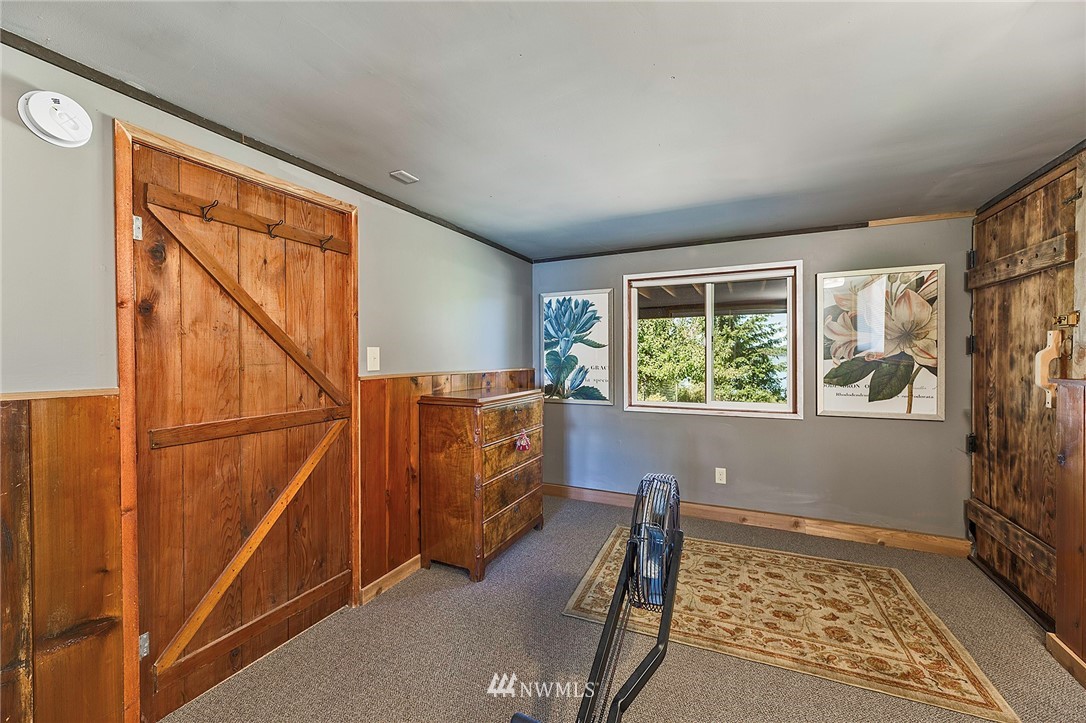 14301 Outer Bay Road Anderson Island, WA 98303 - Photo 21 of 40 an empty room with windows