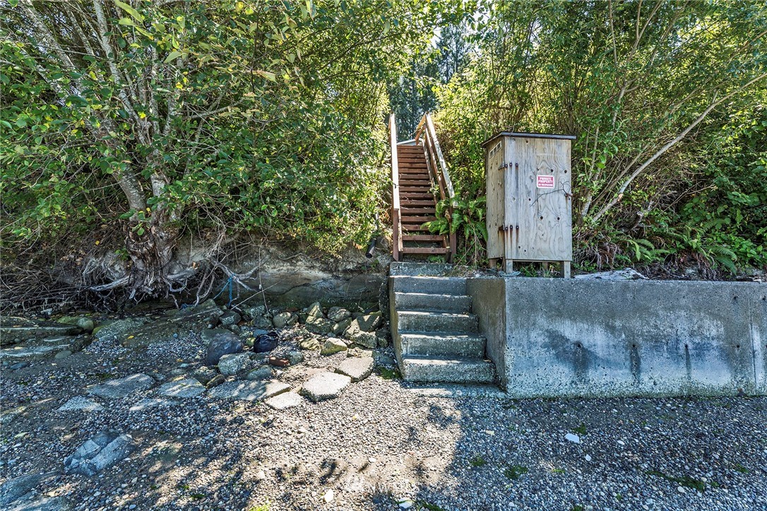 14301 Outer Bay Road Anderson Island, WA 98303 - Photo 27 of 40 a pathway of a house with a yard