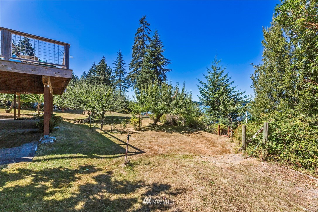 14301 Outer Bay Road Anderson Island, WA 98303 - Photo 33 of 40 a view of a yard with an outdoor space