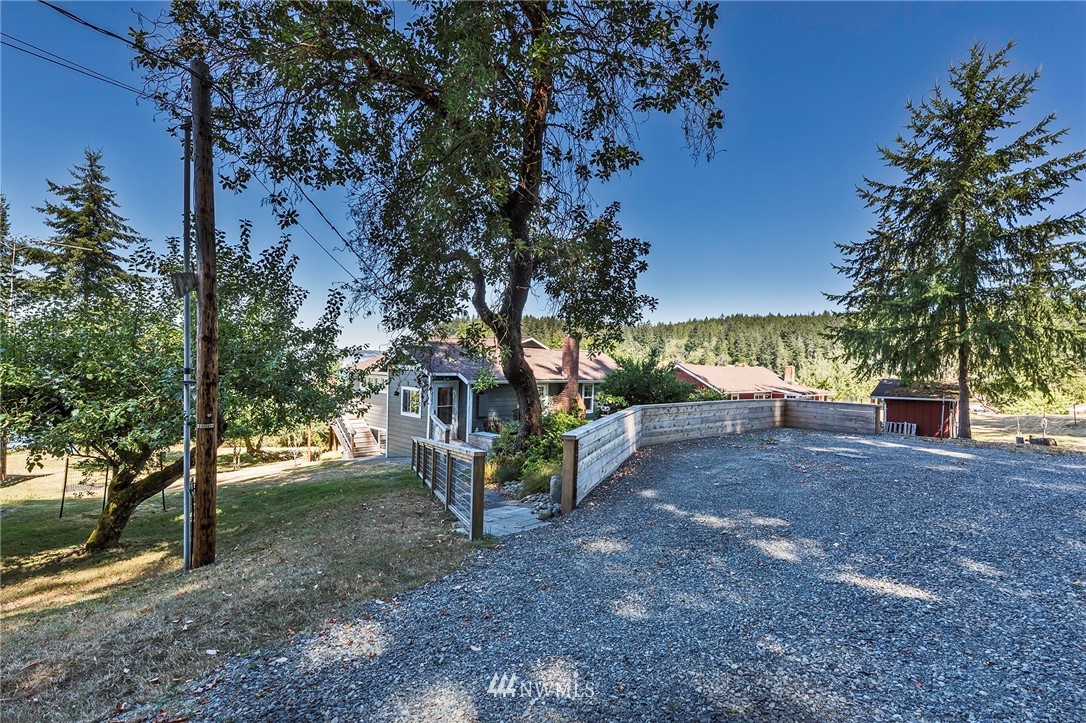 14301 Outer Bay Road Anderson Island, WA 98303 - Photo 35 of 40 a view of a yard with plants and trees
