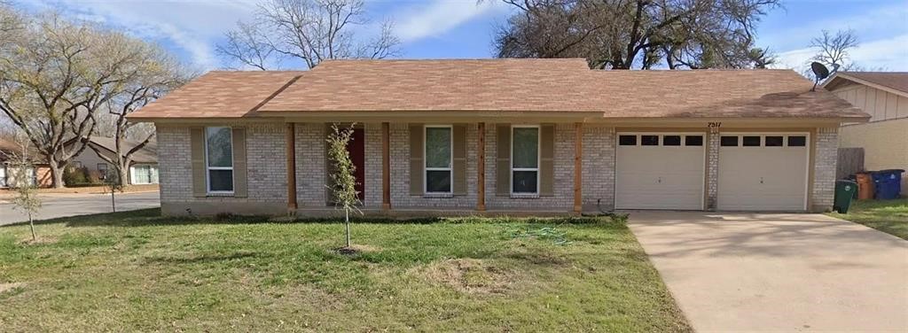 2517 Berkeley Avenue Austin, TX 78745 - Photo 1 of 1 a front view of a house with garden