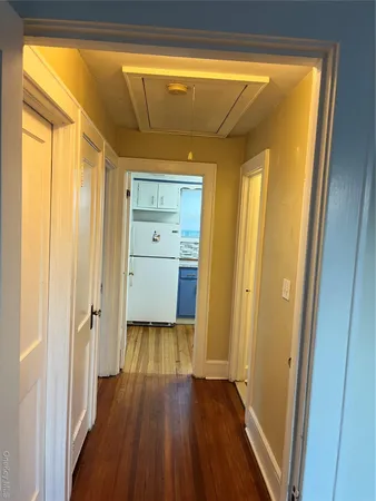 a room with wooden floor and sliding door
