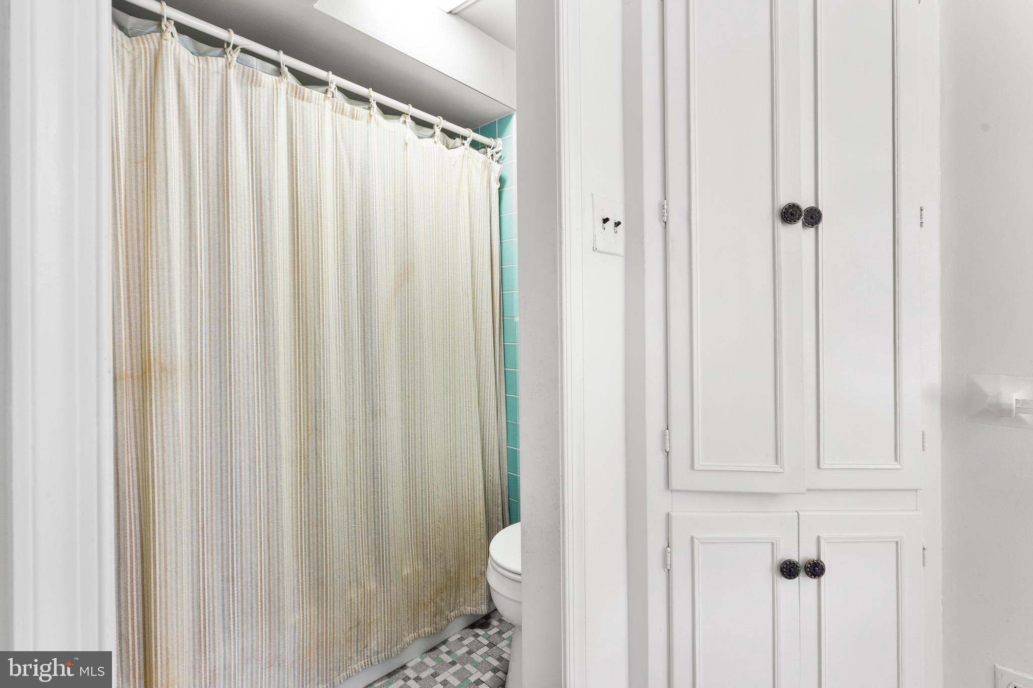15 Llanfair Road, Unit B Ardmore, PA 19003 - Photo 12 of 25 a bathroom with a shower curtain and a curtain