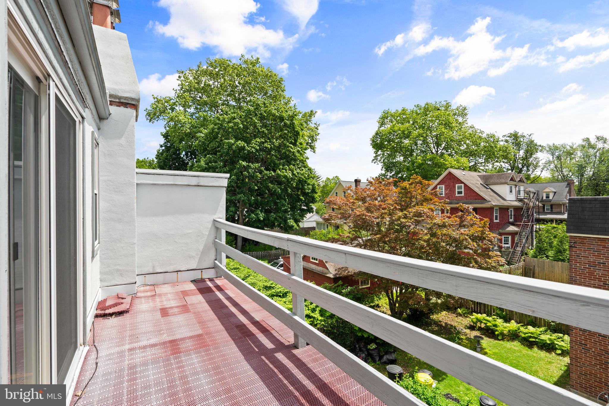 15 Llanfair Road, Unit B Ardmore, PA 19003 - Photo 17 of 25 a view of a balcony with wooden floor