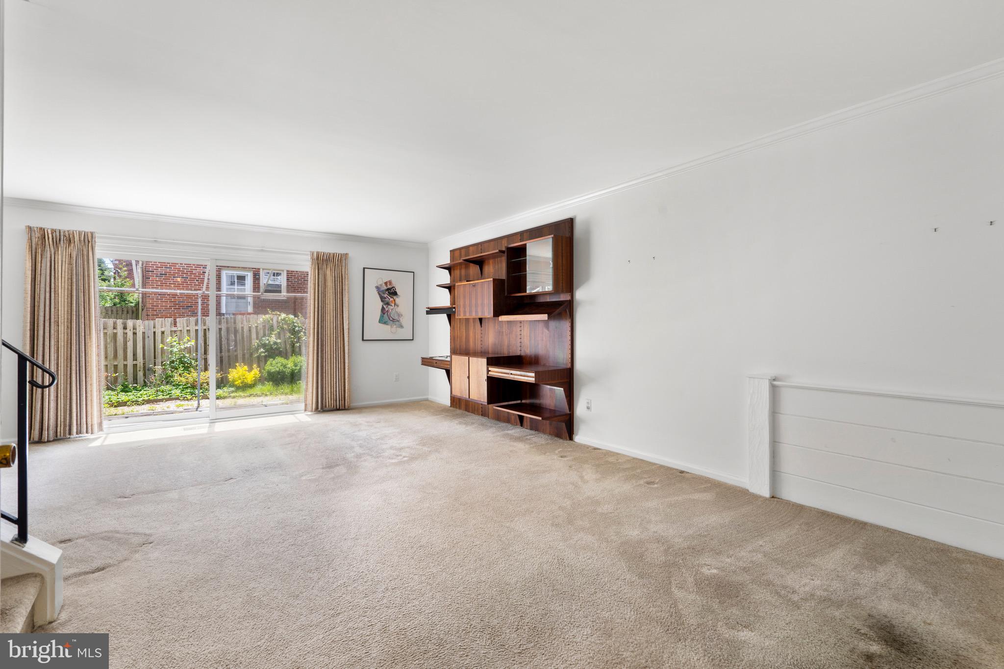 15 Llanfair Road, Unit B Ardmore, PA 19003 - Photo 3 of 25 a view of an empty room with furniture and a window