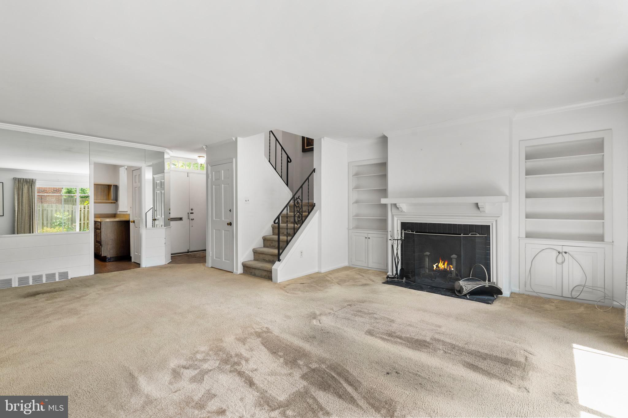 15 Llanfair Road, Unit B Ardmore, PA 19003 - Photo 5 of 25 a view of an empty room with fire place and a fireplace