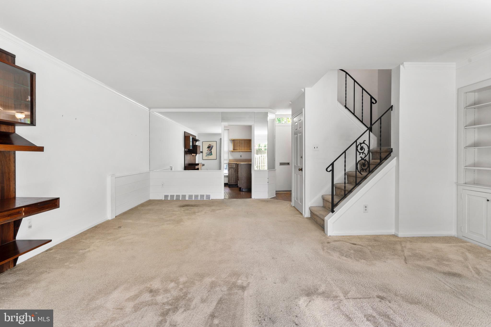 15 Llanfair Road, Unit B Ardmore, PA 19003 - Photo 6 of 25 a view of a livingroom with stairs and a living room