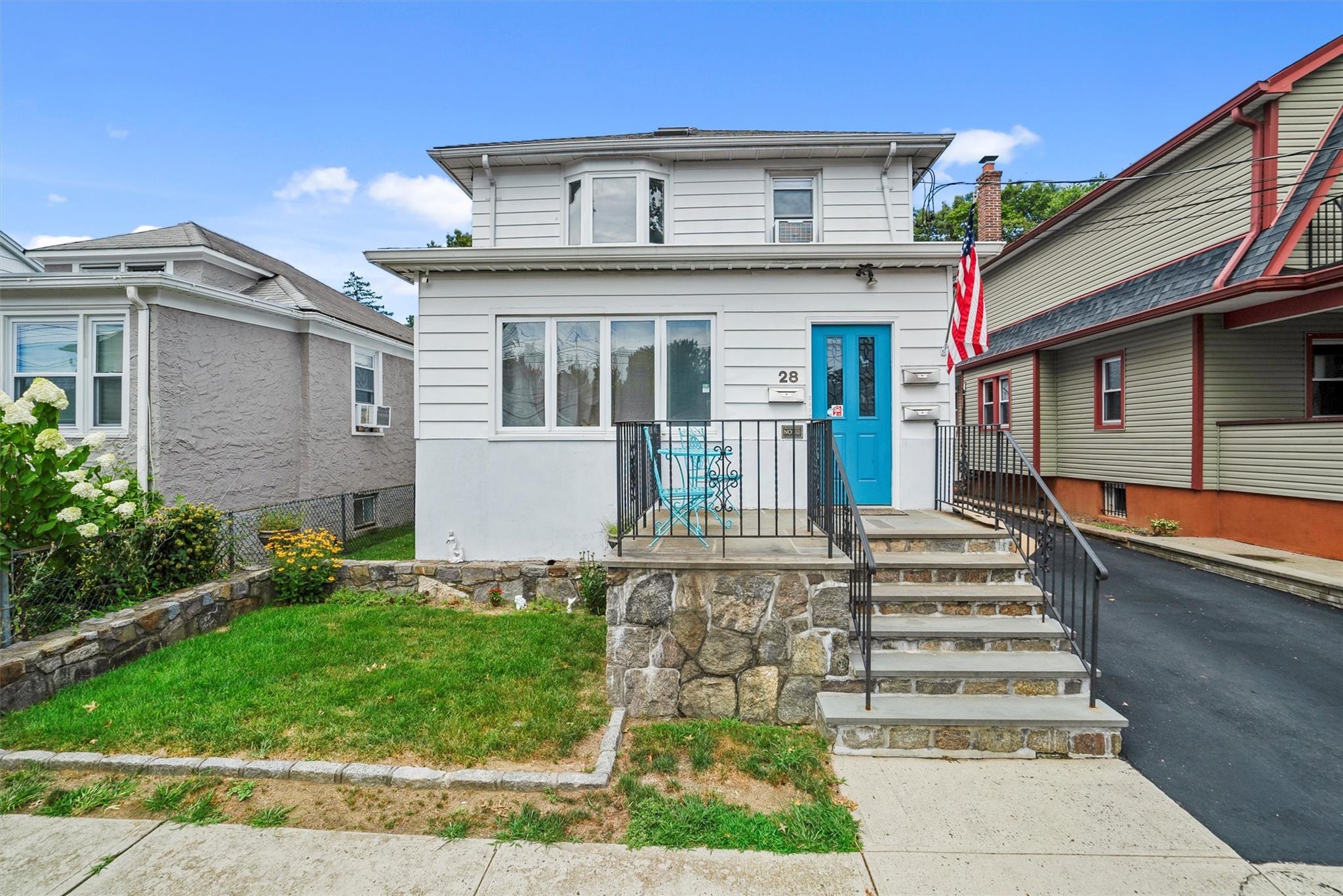 28 Acorn Terrace New Rochelle, NY 10801 - Photo 1 of 1 a front view of a house with a yard