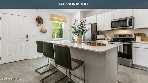 a kitchen with a sink cabinets and window