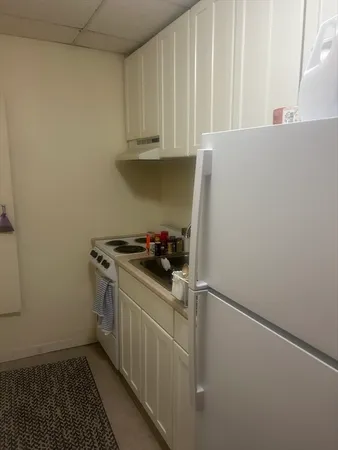 a kitchen with stainless steel appliances a stove and a refrigerator
