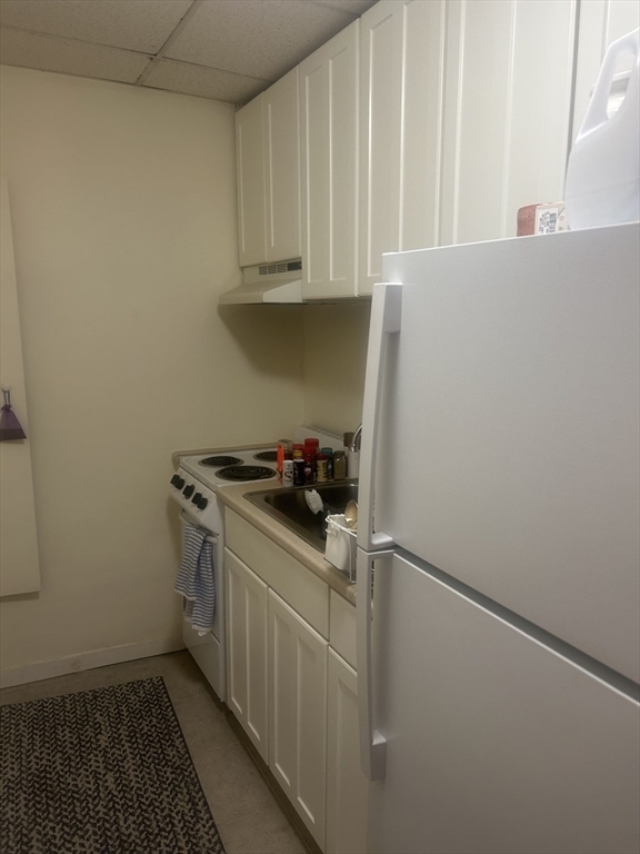 857 Beacon Street, Unit B2 Boston, MA 02215 - Photo 1 of 6 a kitchen with stainless steel appliances a stove and a refrigerator