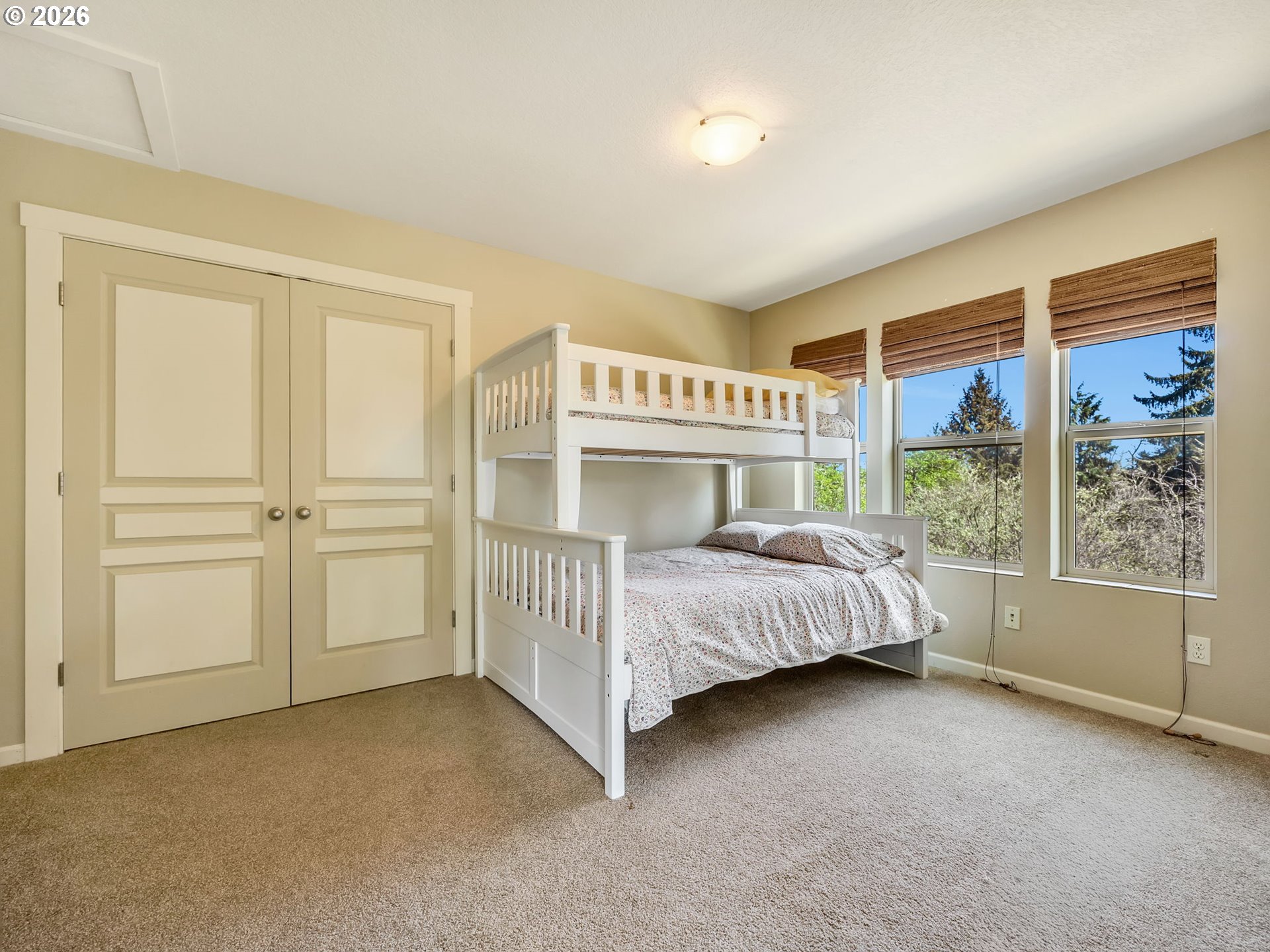 1077 Southwest Ridge Road Warrenton, OR 97146 - Photo 39 of 46 a bed sitting in a room next to a window