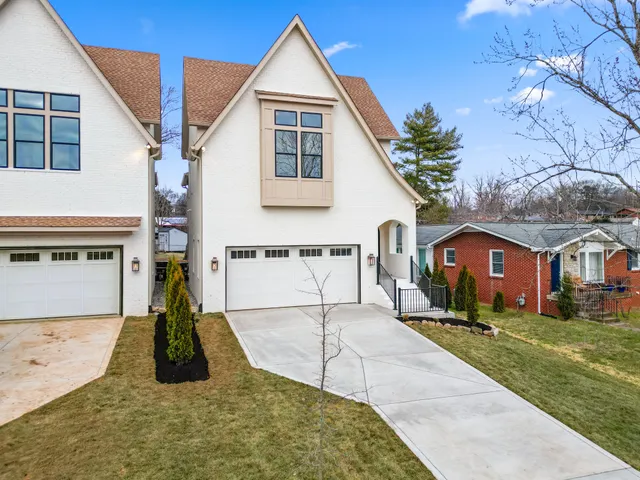 a view of house with yard and entertaining space