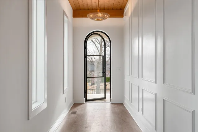 a view of a livingroom with wooden floor window