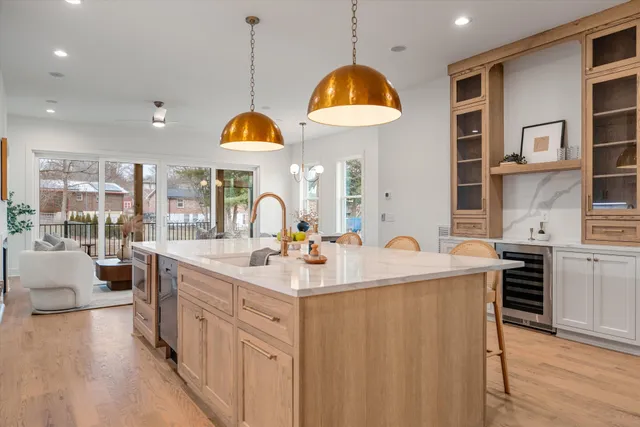 a kitchen with stainless steel appliances granite countertop a sink and a stove
