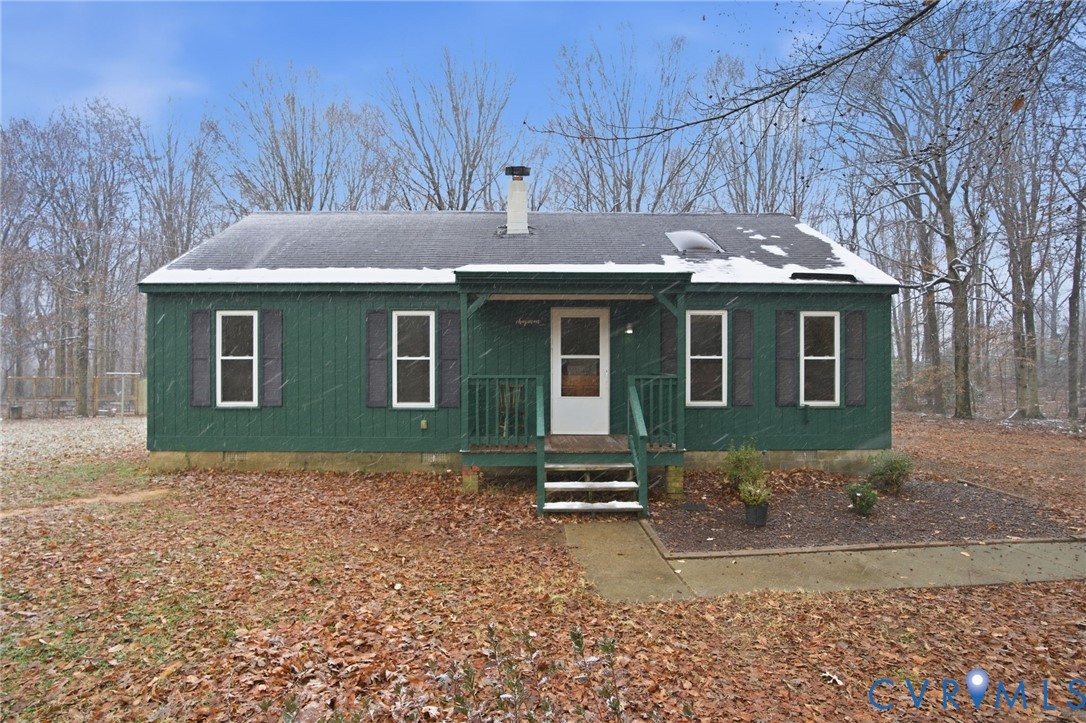 Ranch-style home featuring a porch