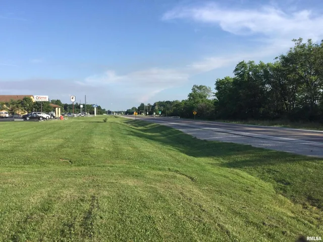 a view of a golf course with a lake