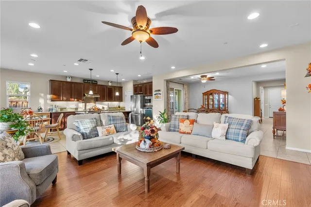a living room with furniture kitchen and a window