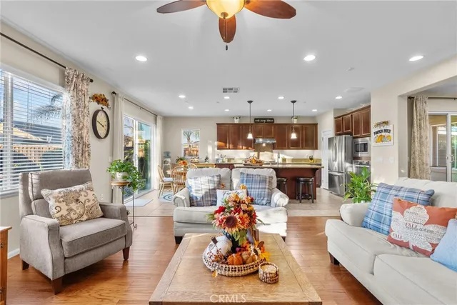 a living room with fireplace furniture and a flat screen tv