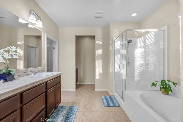 a bathroom with a toilet sink and shower