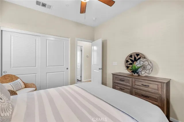 a bedroom with a bed and a dresser